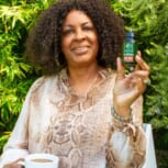 BLACK-WOMAN-OUTDOORS-WITH-MODAE-CBD-SOFTGEL-CURCUMIN